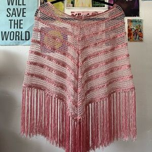 pink fringe poncho very y2k, reminds of hannah montana or sharply evans